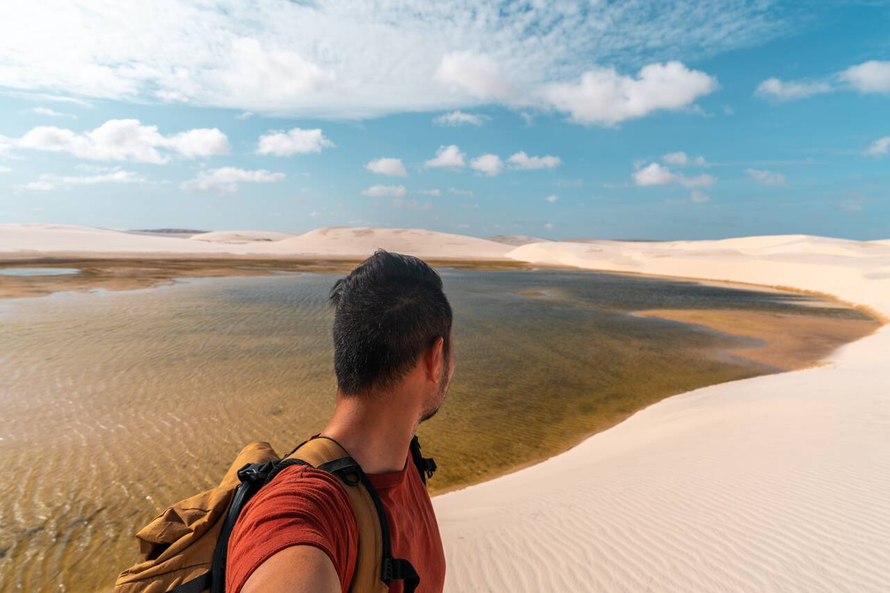 Me looking at a lagoon in Lencois Maranhenses