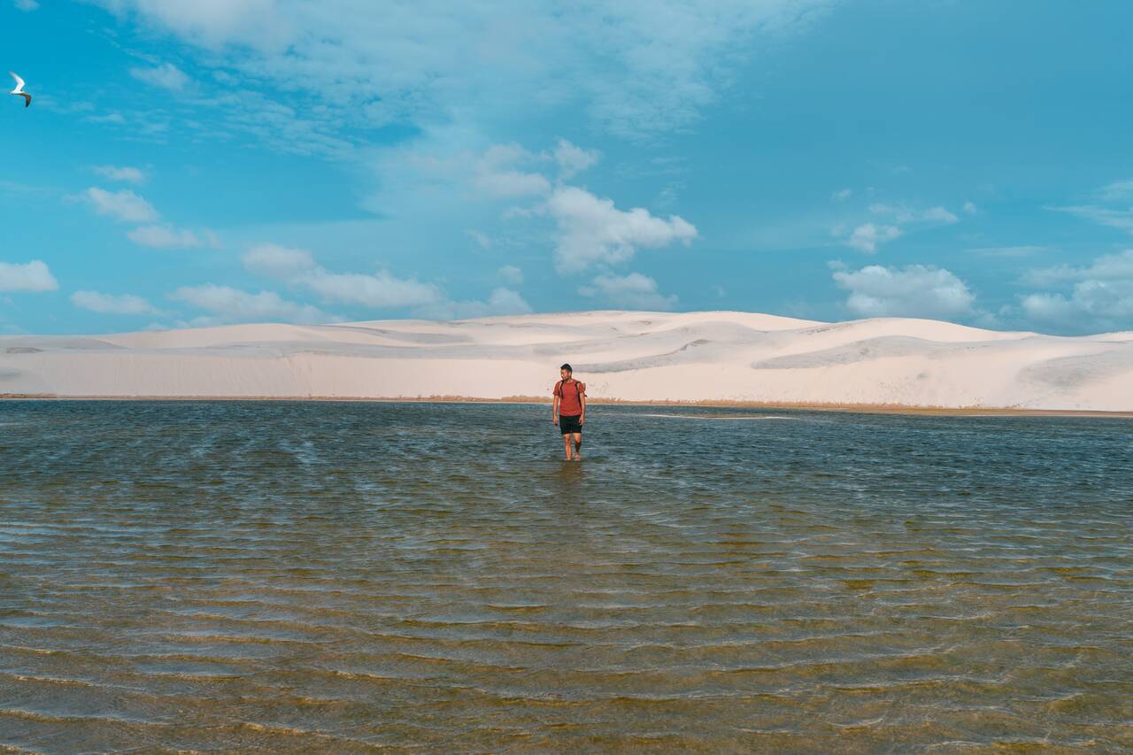 Me walking in the middle of a lagoon in Lençóis Maranhenses