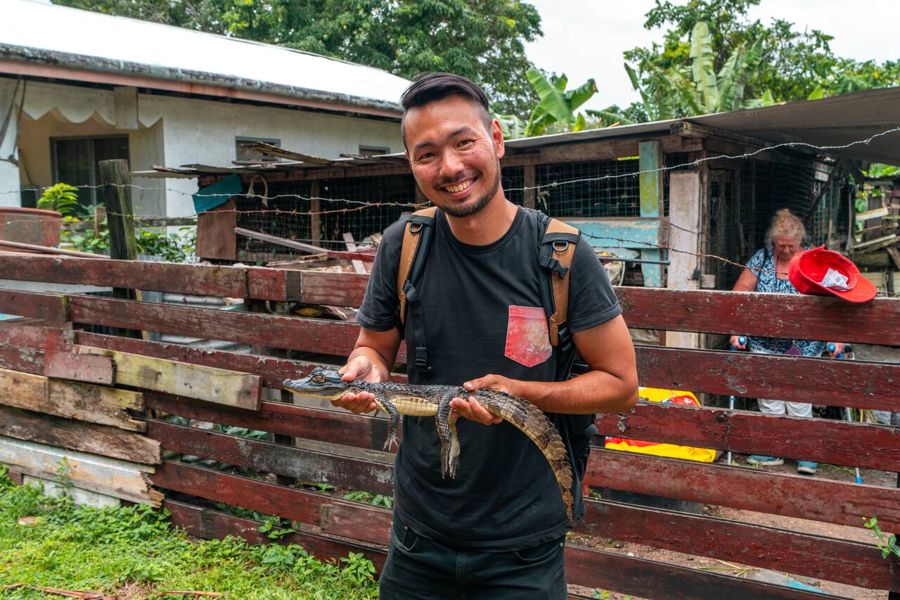 Me holding a caiman at Rust en Werk plantation