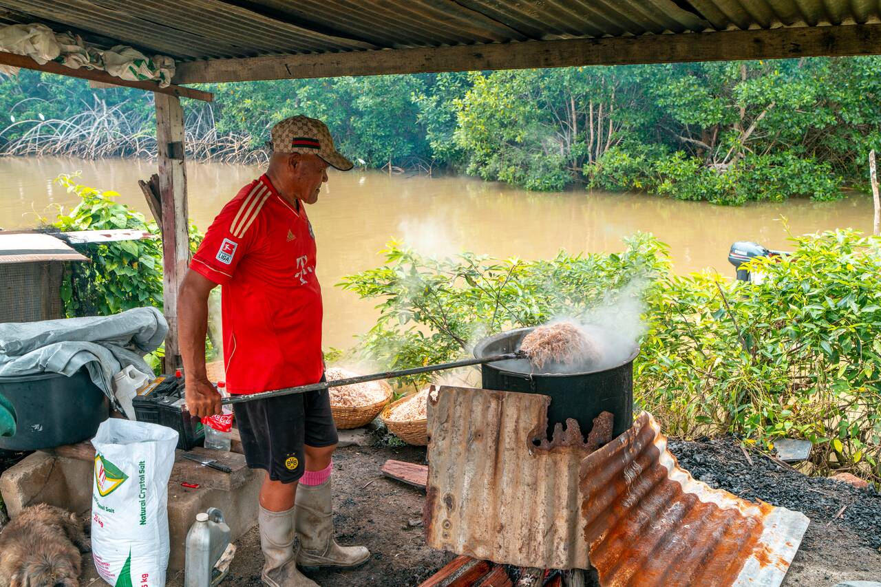 A local indonesian in Suriname preparing shrimps