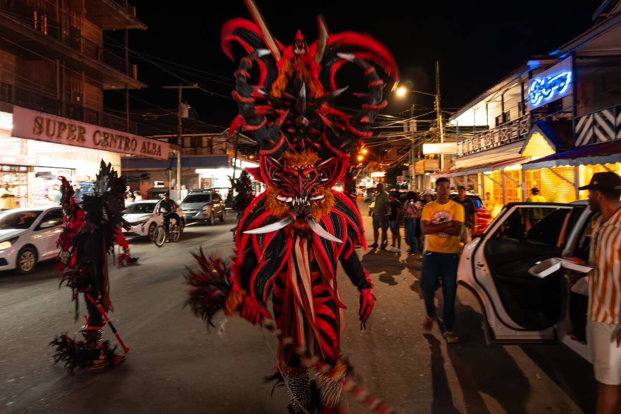 A person wearing scary masks at Bocas Carnival