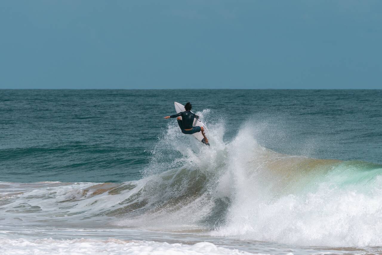 A man surfing at Bluff Beach