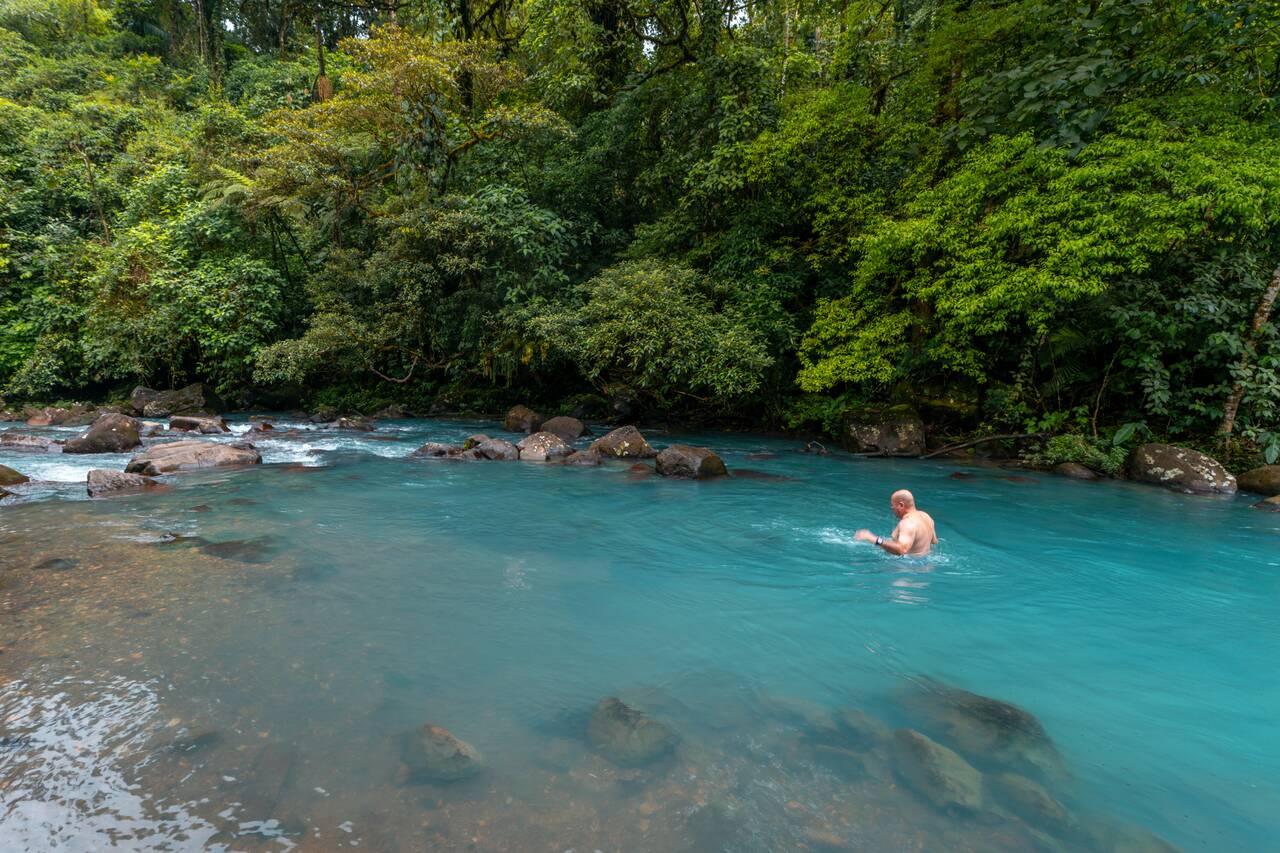 A person swimming in the Celeste River