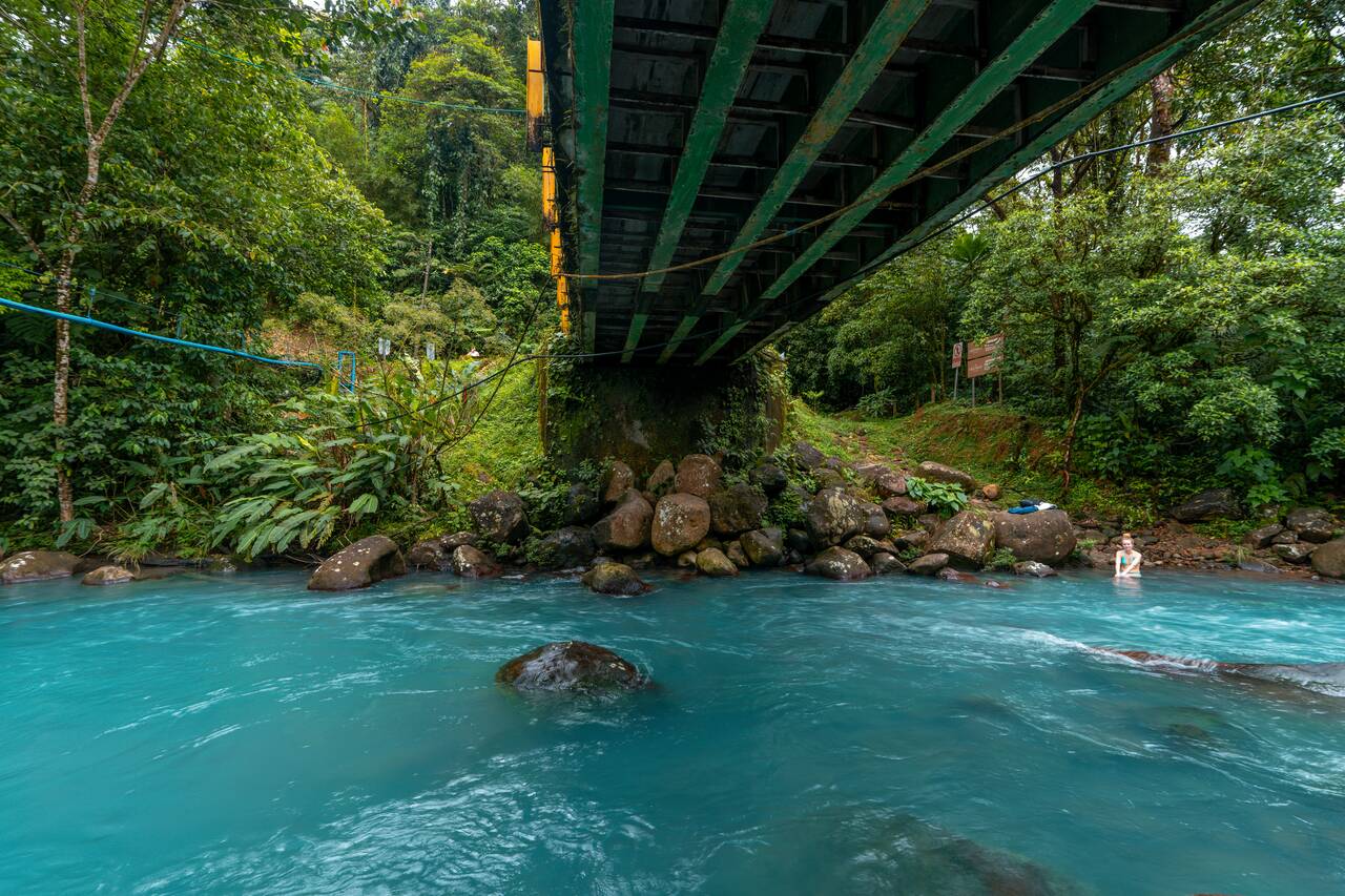 Celeste River flowing under a bridge