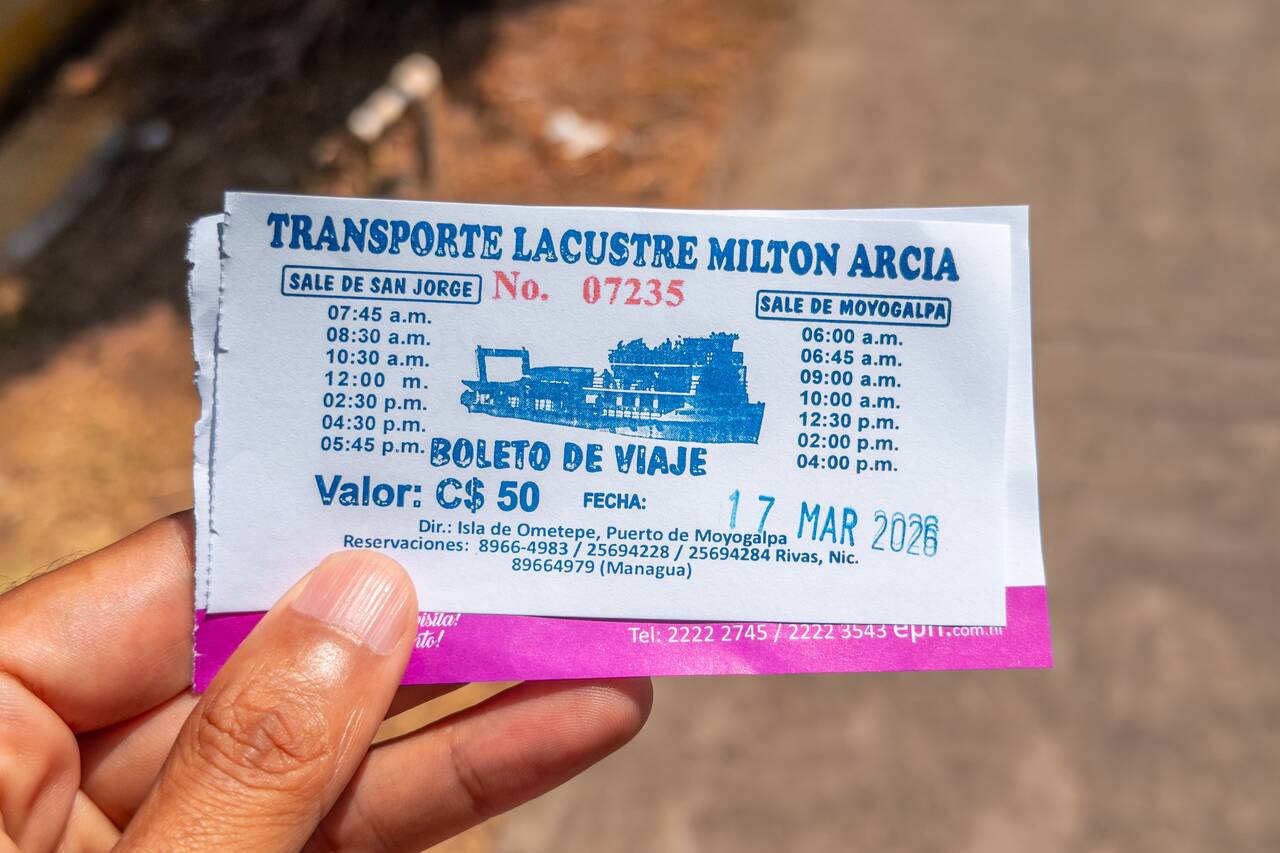 Me holding a ferry ticket to Ometepe