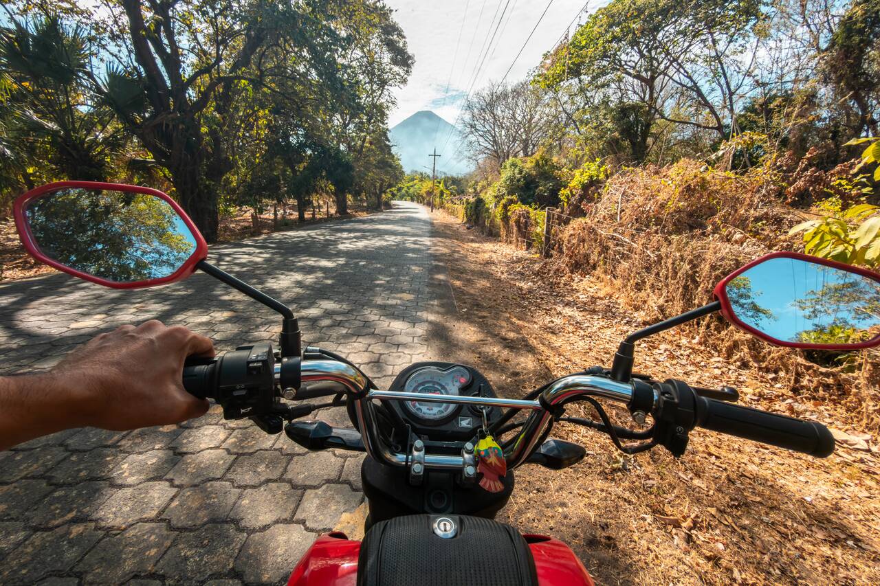 Me on a motorbike in Ometepe with Concepcion Volcano in the background