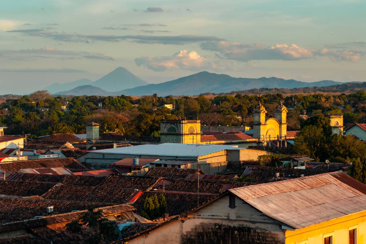A volcano and the cityscape seen from Iglesia La Merced