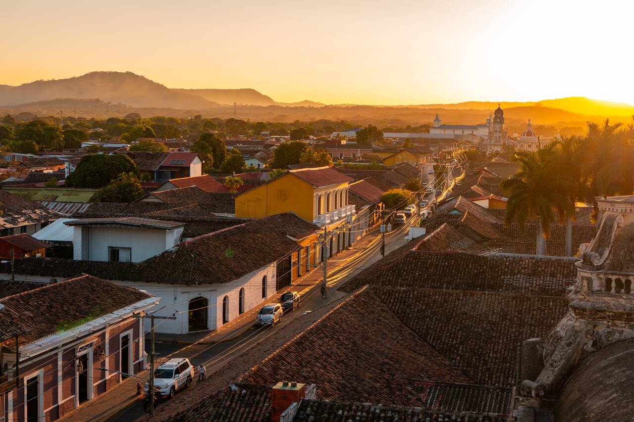 The evening street of Granada seen from Iglesia La Merced
