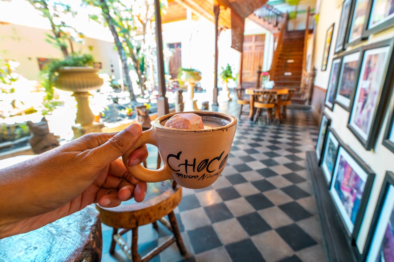 Me holding a hot cocoa drink at ChocoMuseo Granada