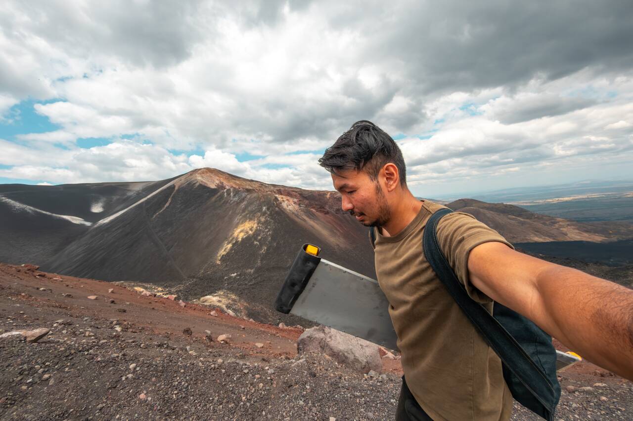 Me hiking up Cerro Negro with my board