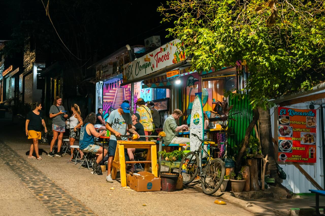 People at El Compa Tacos at night