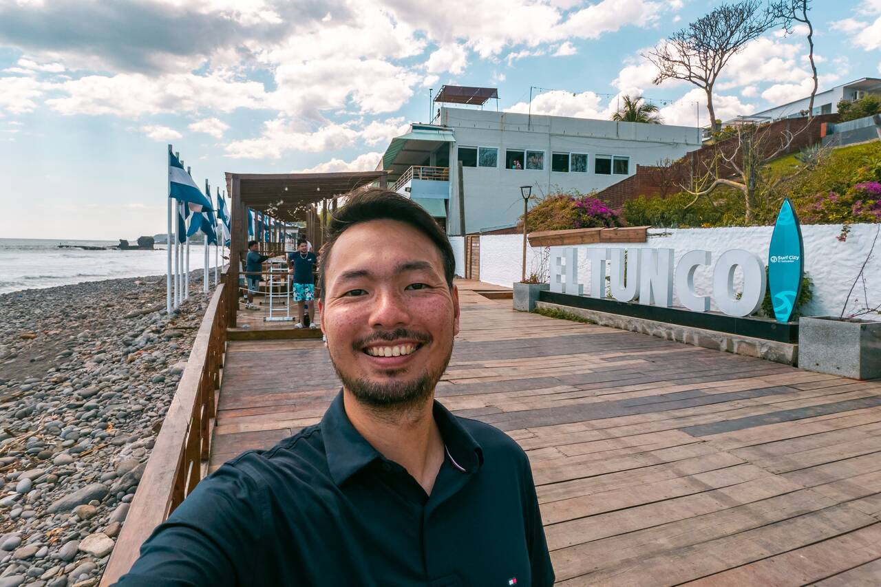 A selfie of me at El Tunco sign at El Tunco's Beachfront Promenade
