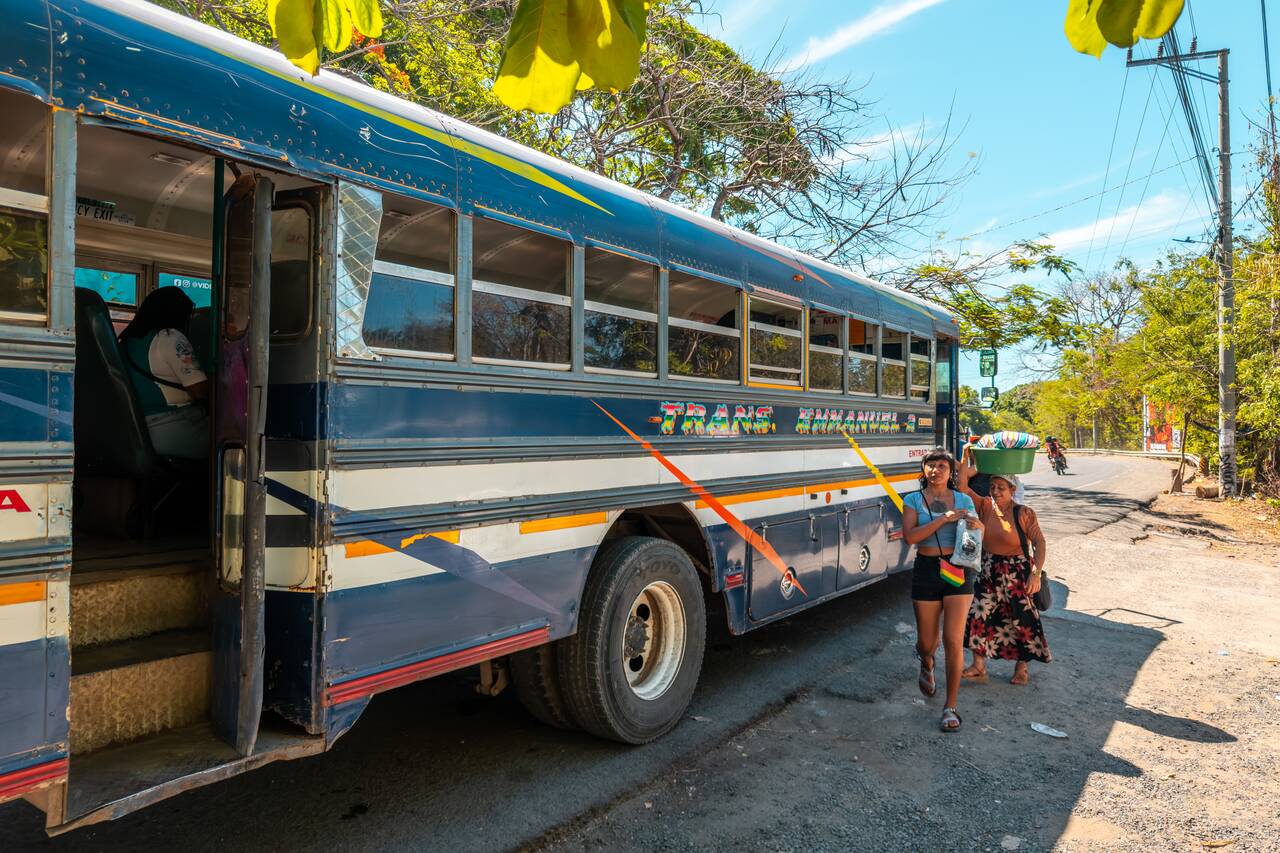 A local getting off a bus in El Tunco