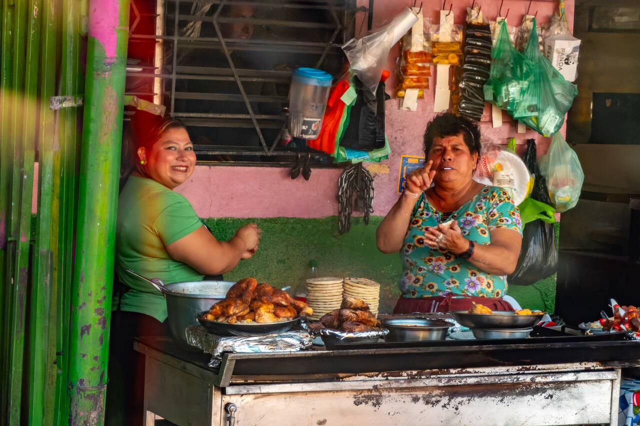 Locals in El Salvador smiling at the camera