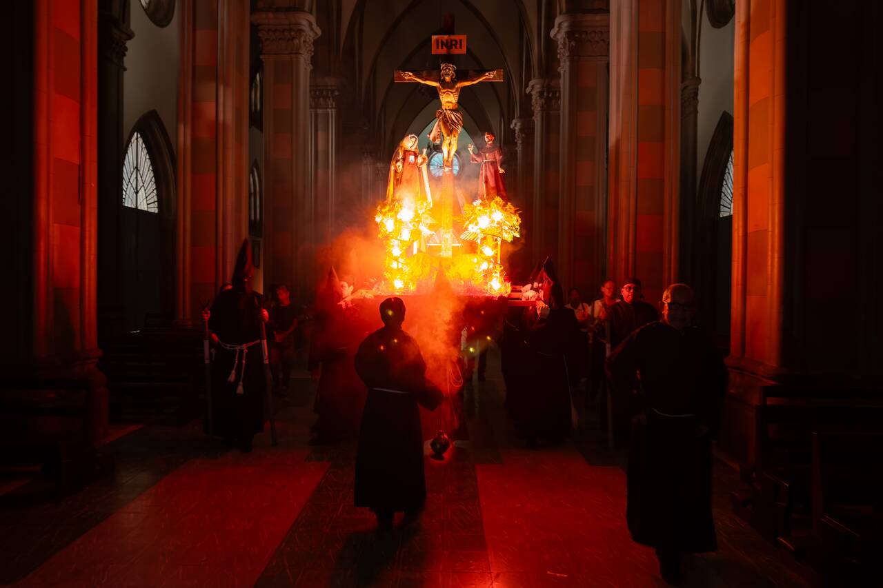 A procession during Semana Santa being held inside Santa Ana Cathedral