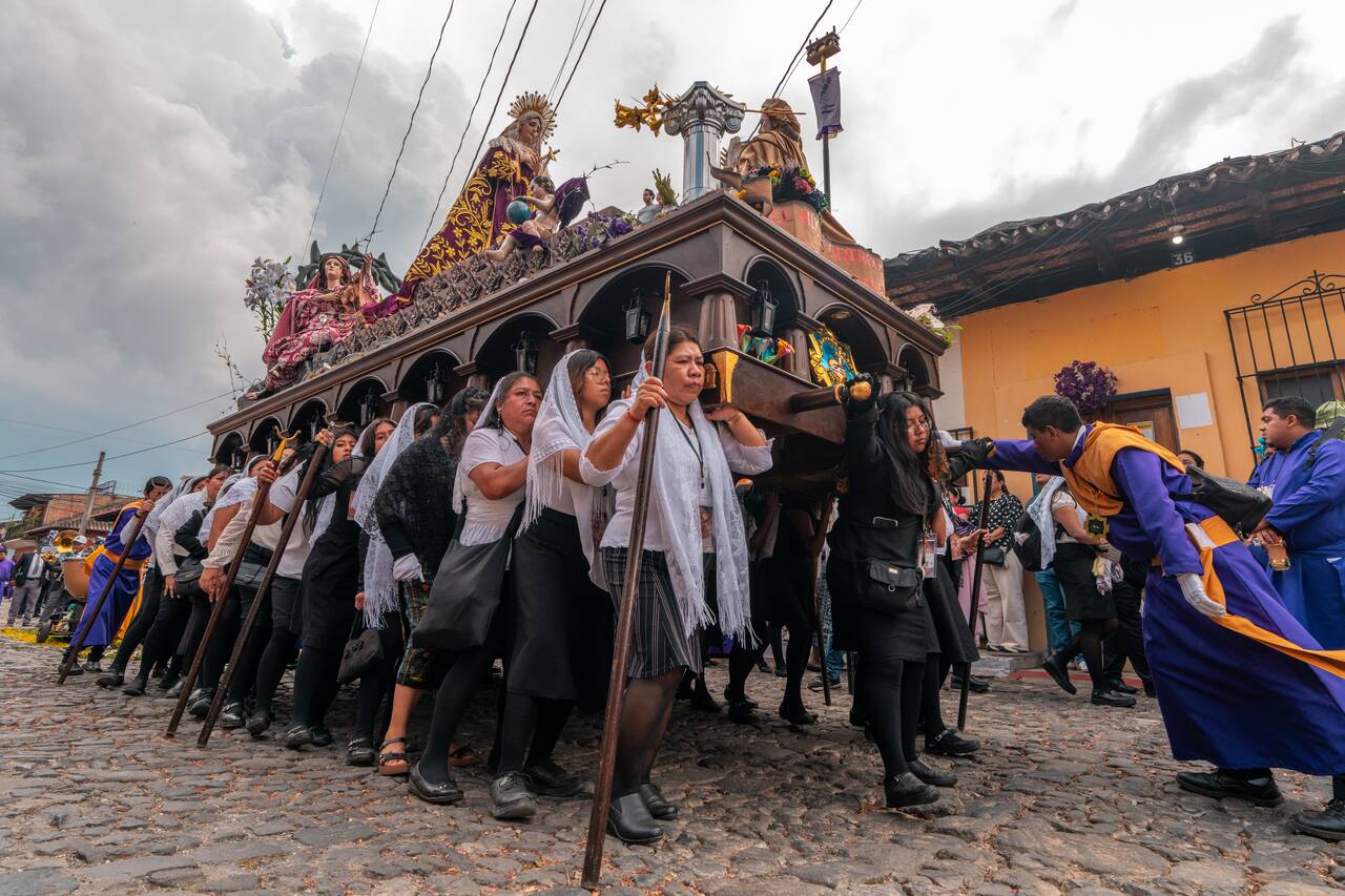 A group of women carrying a float in Antigua during Semana Santa