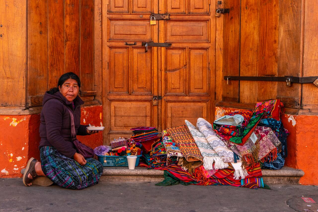 A local selling textiles at Antigua