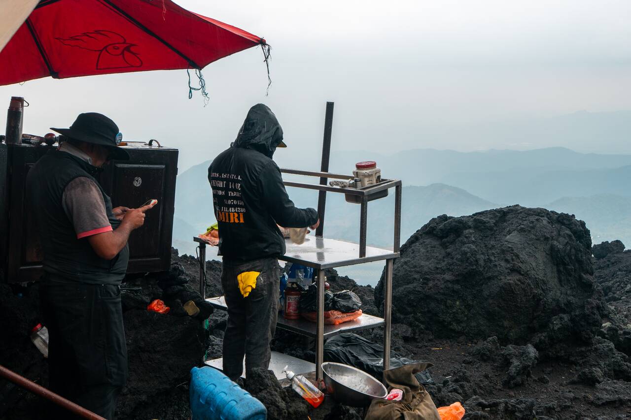 A local preparing a pizza on Pacaya Volcano