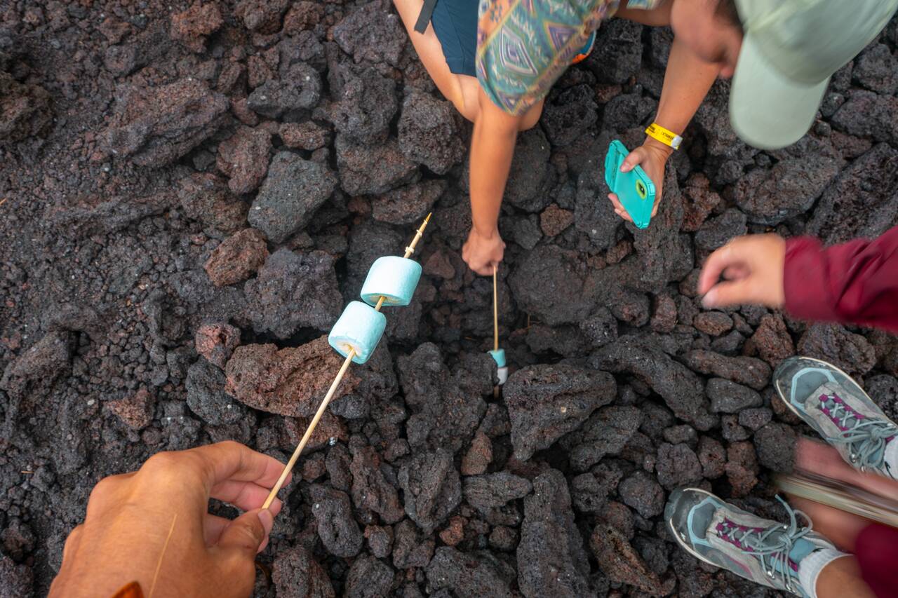 Me and my friends trying to heat a stick of marshmallow at Pacaya's lava field
