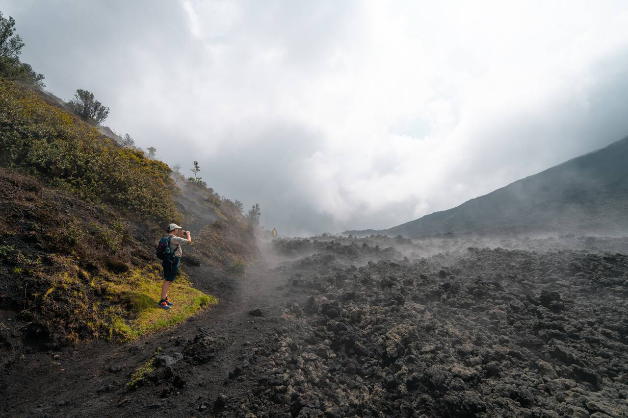 My friend taking photos of the lava field on Pacaya