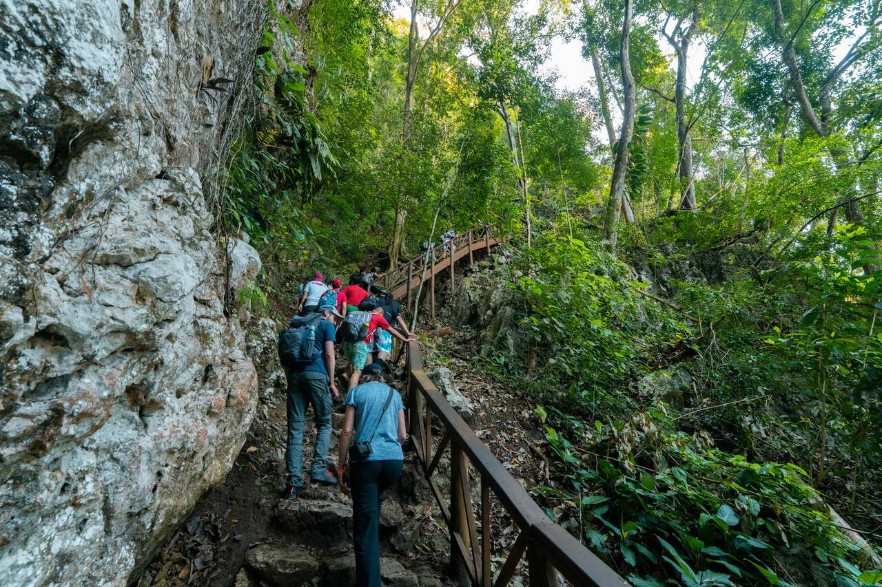 People hiking up to the viewpoint in Semuc Champey
