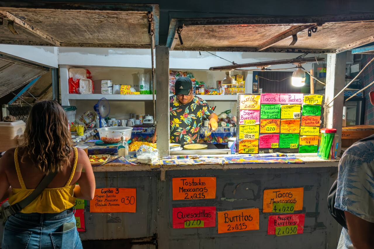 The guy cooking at Tacos Los Peches