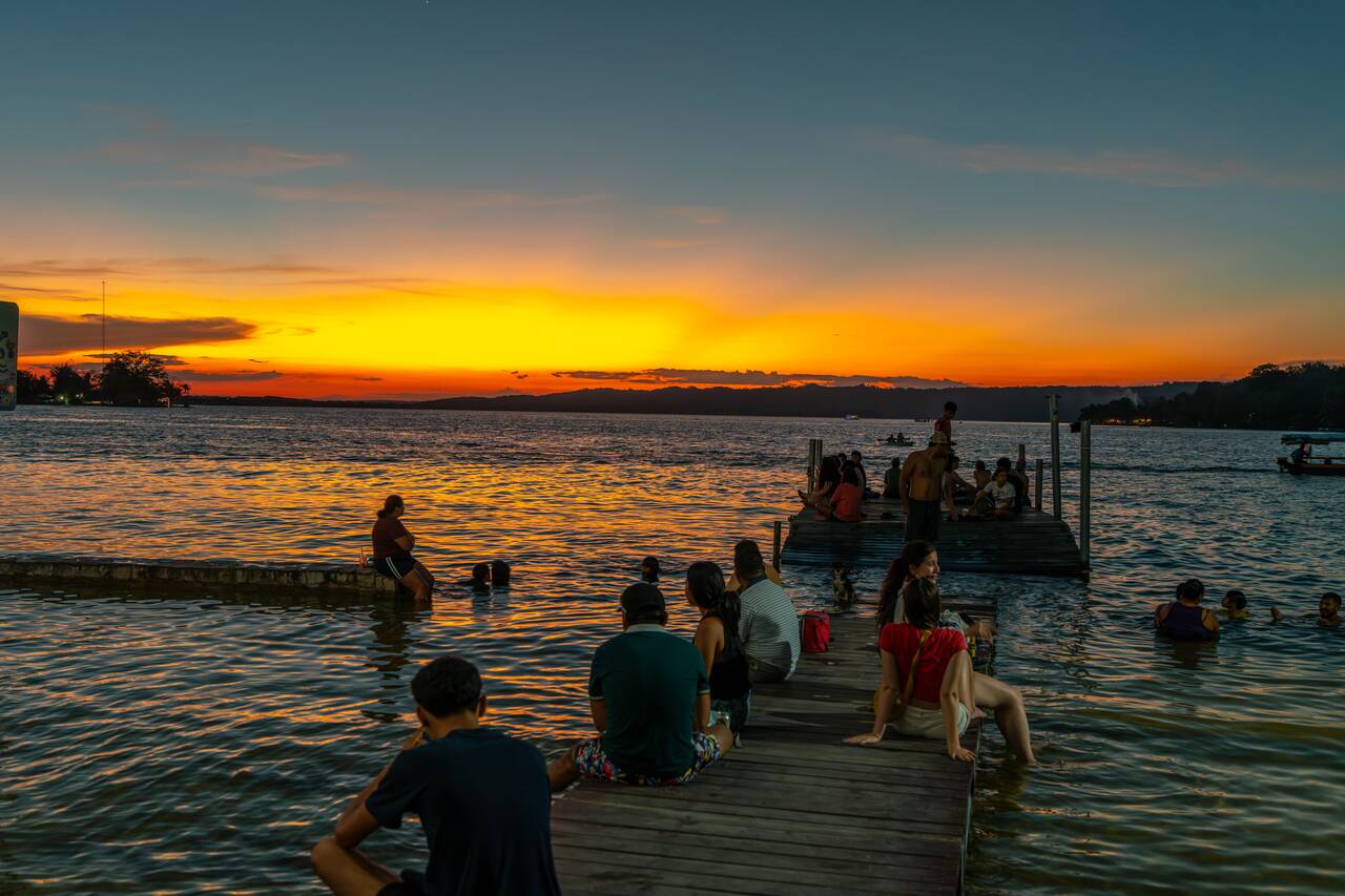 People watching the sunset at along the Malecón in Flores