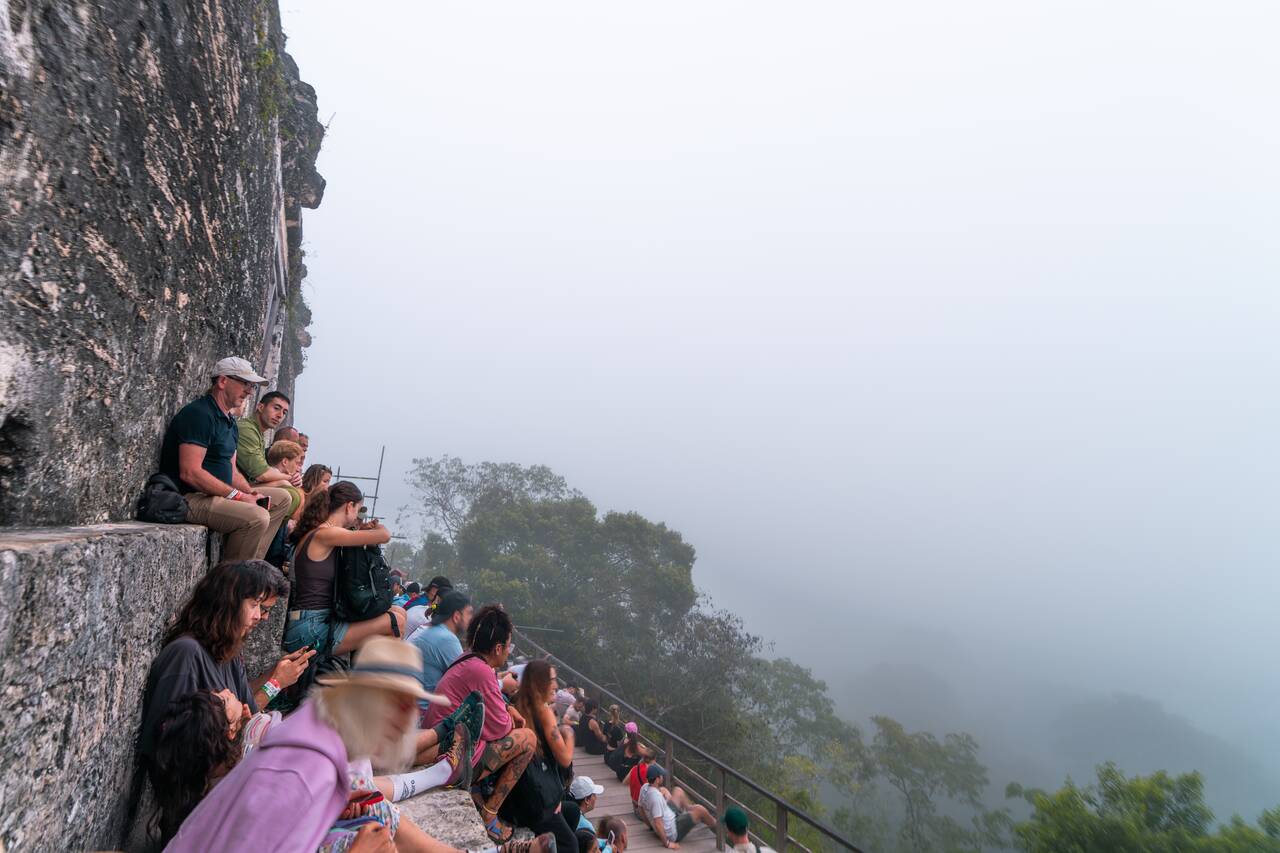 People waiting for the sunrise that never came at Tikal