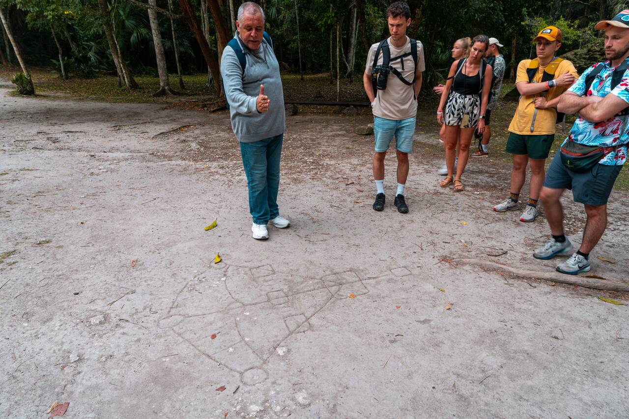 Our guide explaining the story behind temples in Tikal