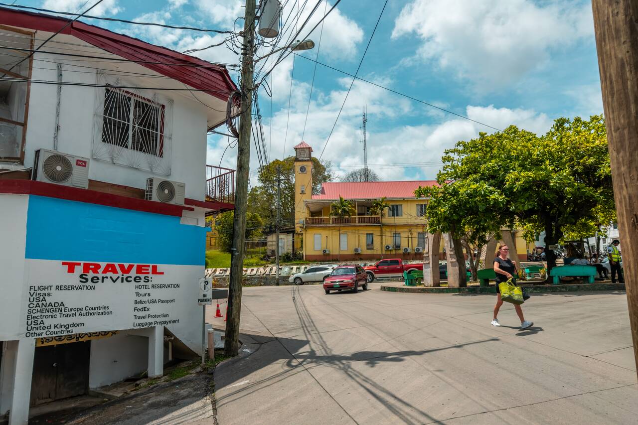 A tourist walking on the street of San Ignacio