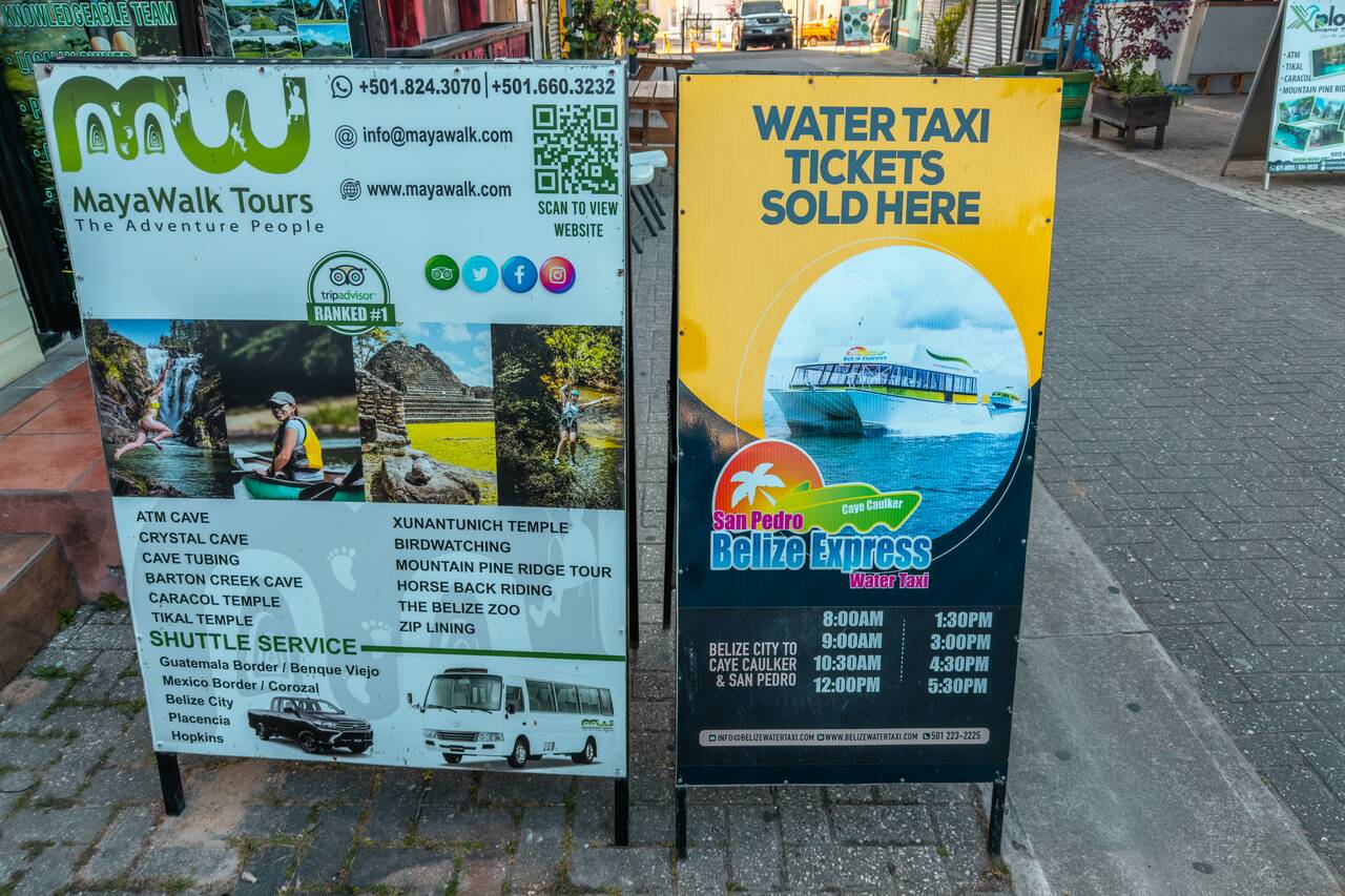 A tour board advertising ATM Cave Tour