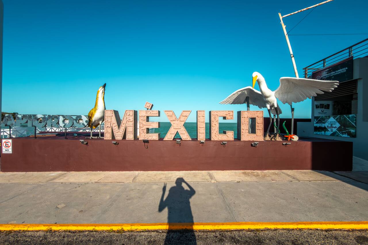 Me posing at a Mexico sign after crossing the border from Caye Caulker to Chetumal