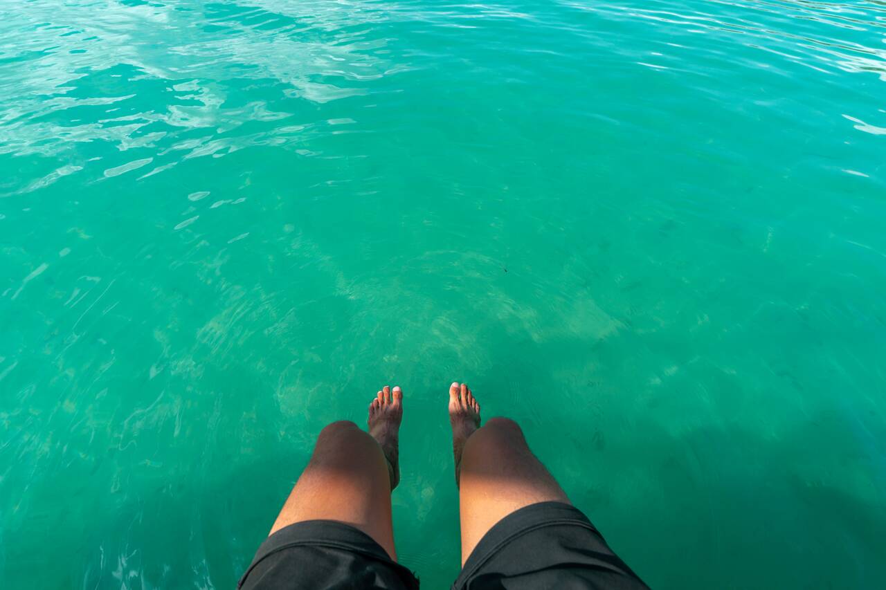 My legs hanging into the beautiful water in Bacalar