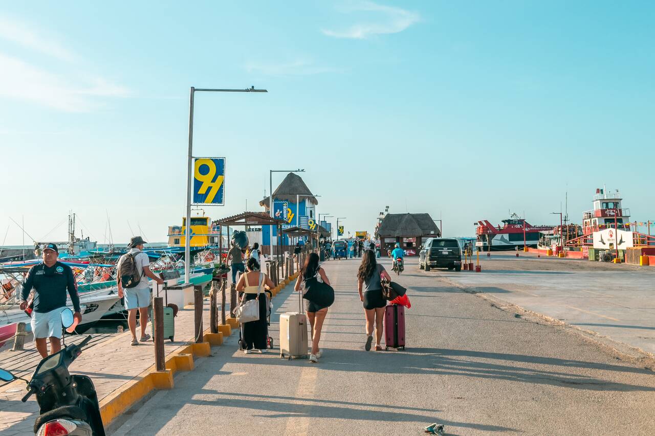 People walking to the ferry to Holbox
