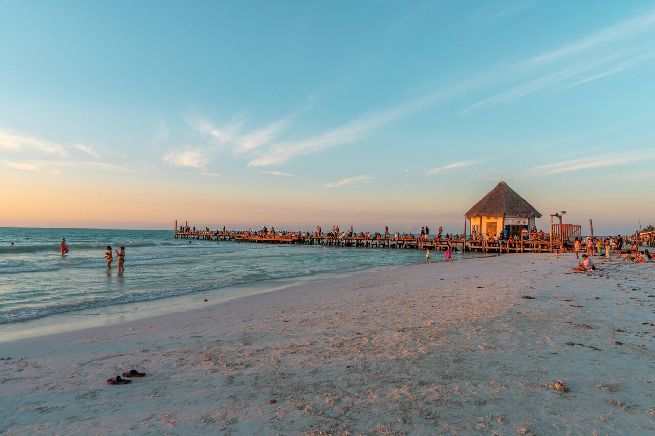 People waiting for the sunset along the dock at Holbox