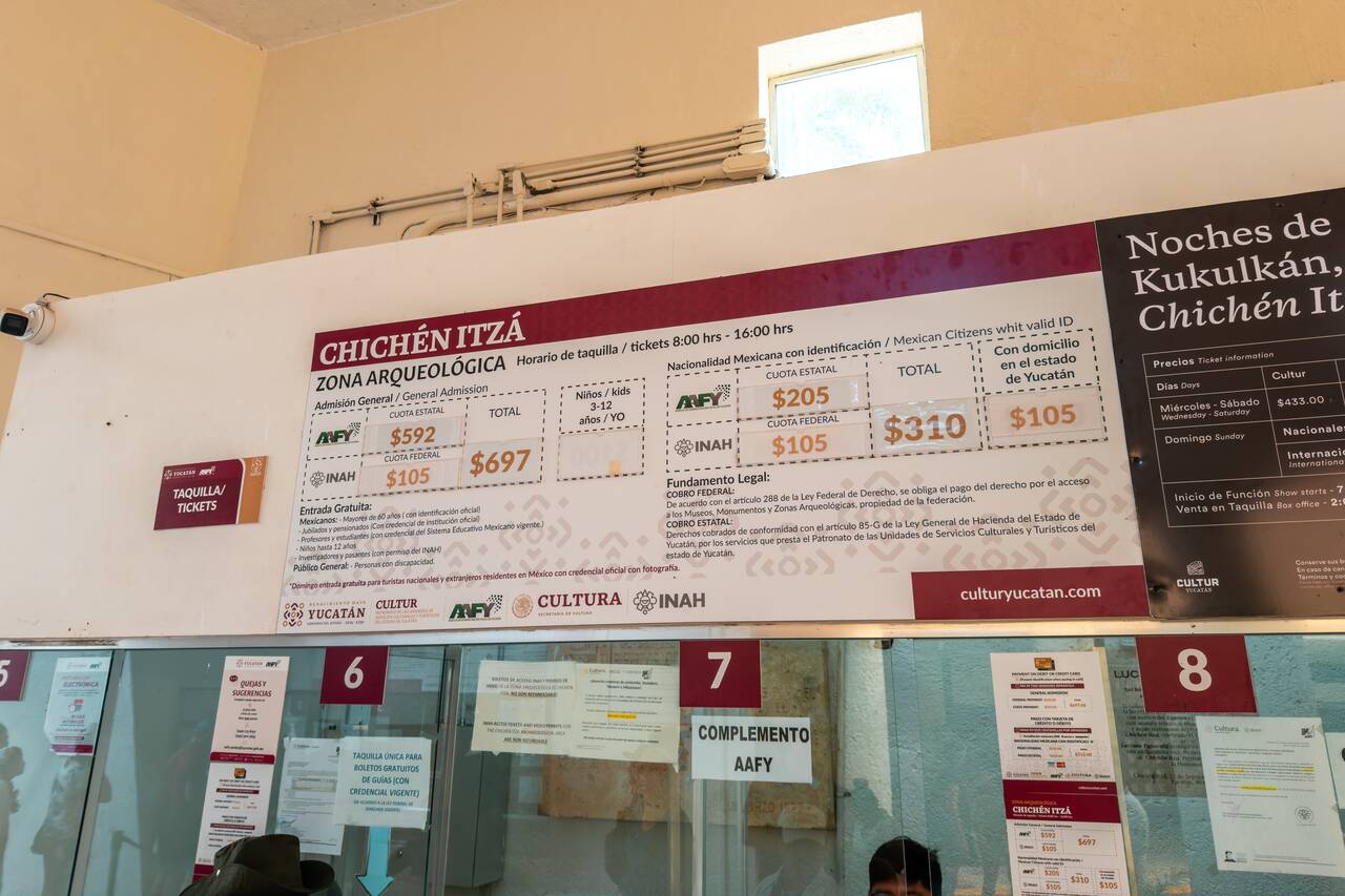 Chichén Itzá Entrance Fee & Opening Hours board at the entrance of Chichen Itza