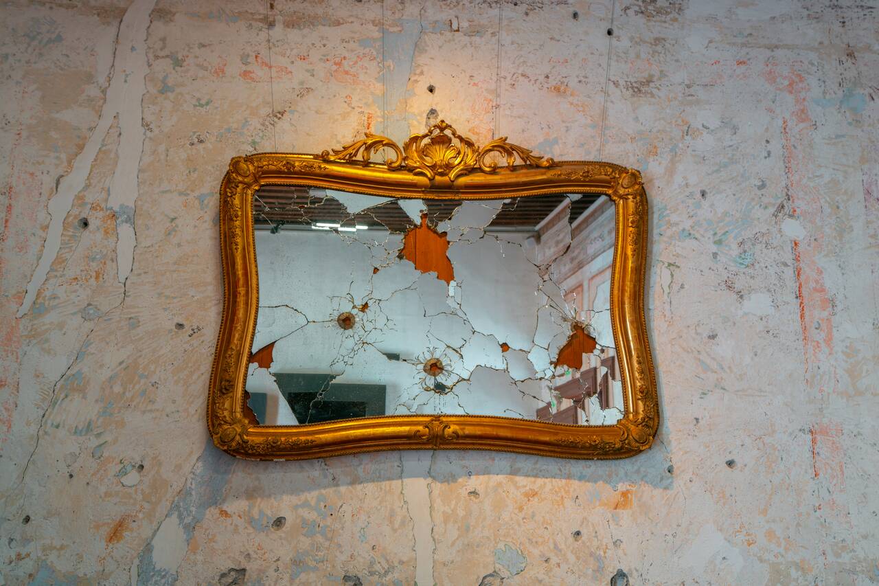 Bullet holes on a mirror at the Revolution Museum