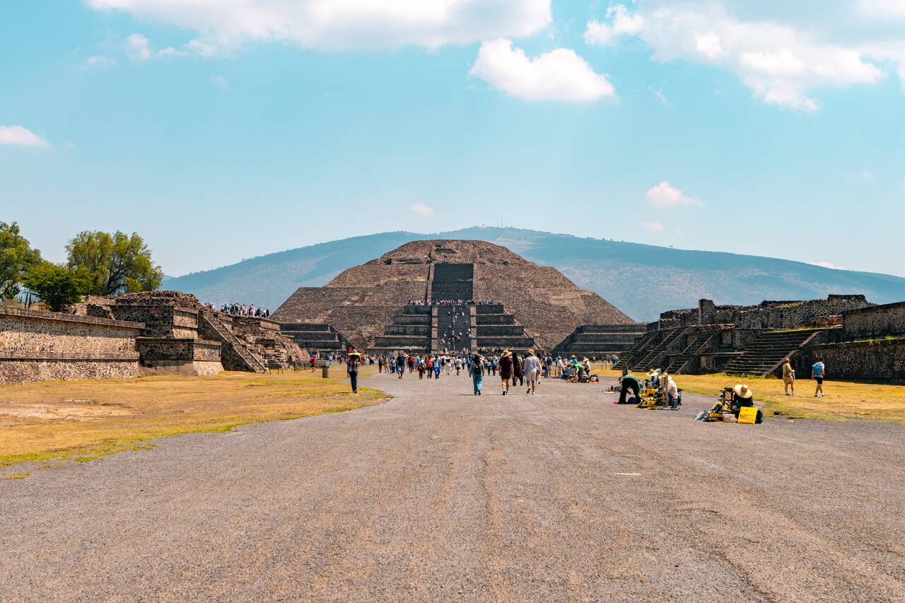People walking at Calzada de los Muertos towards Pyramid of the Moon