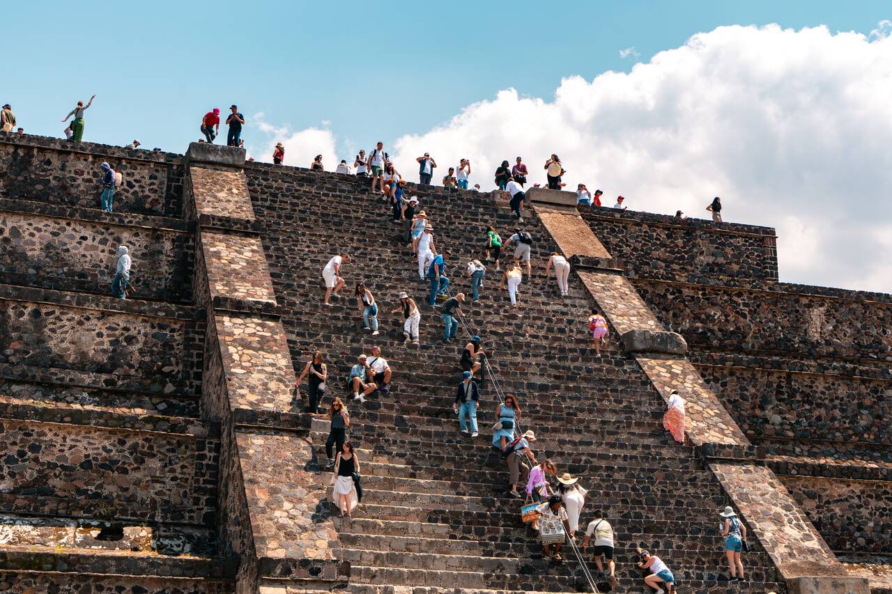 People climbing the Pyramid of the Moon