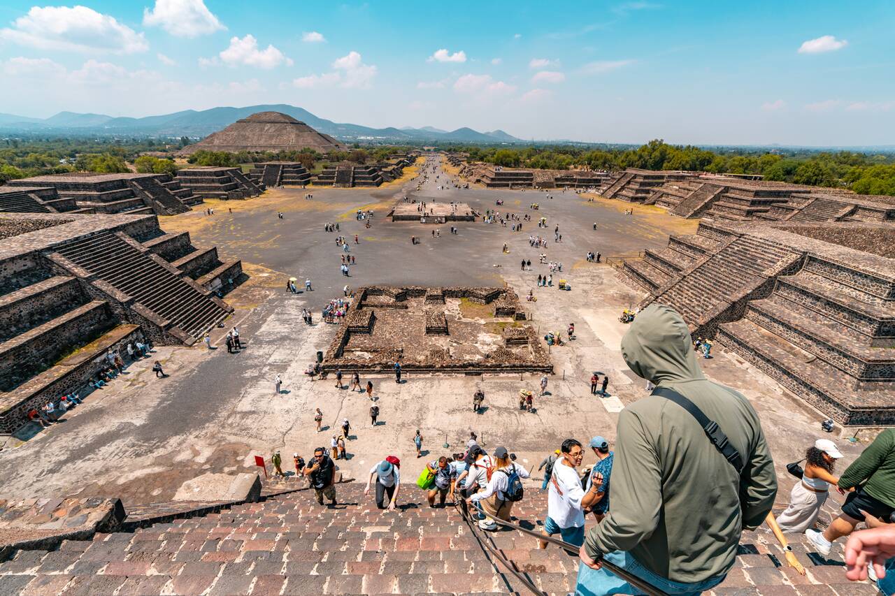 People in light jacket hiking down the Pyramid of the Moon