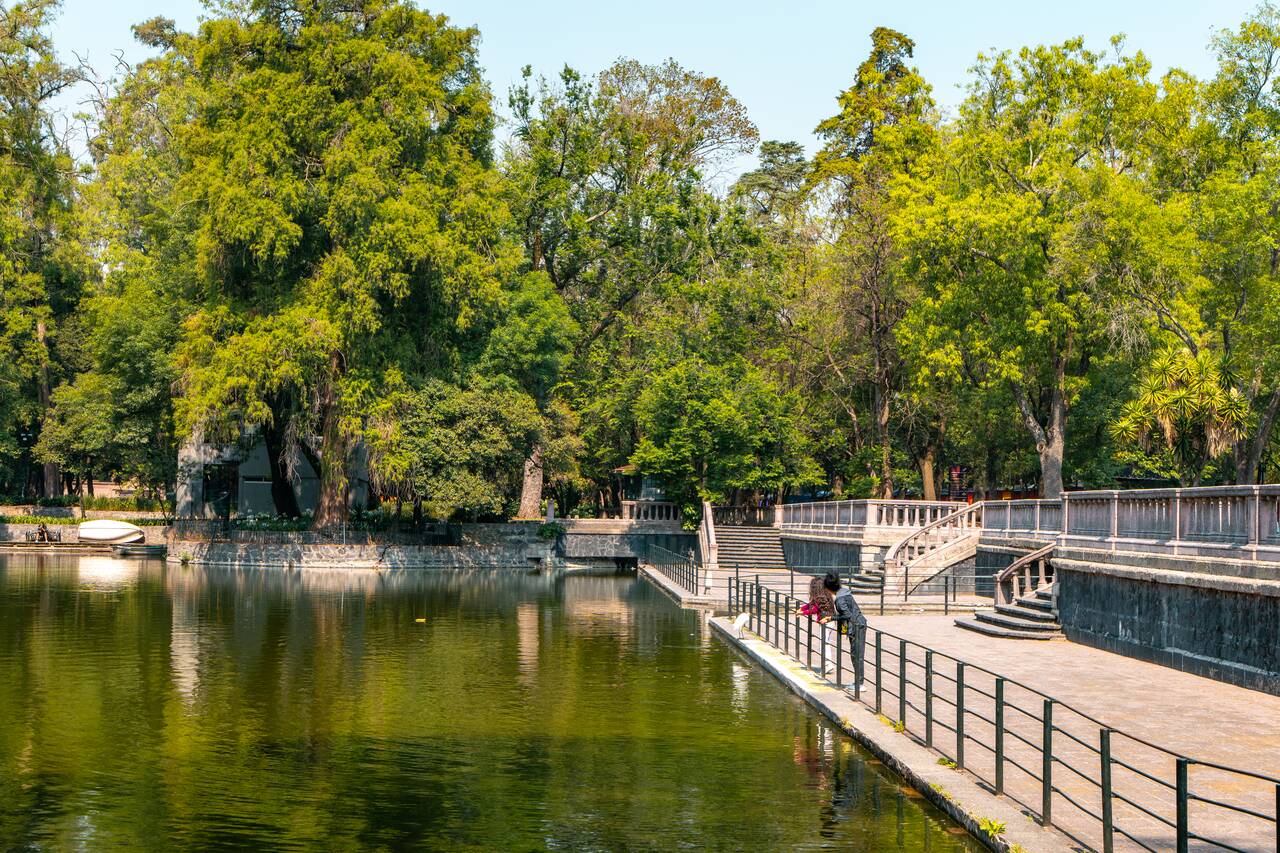 a kid hanging out by the lake at Chapultepec Park