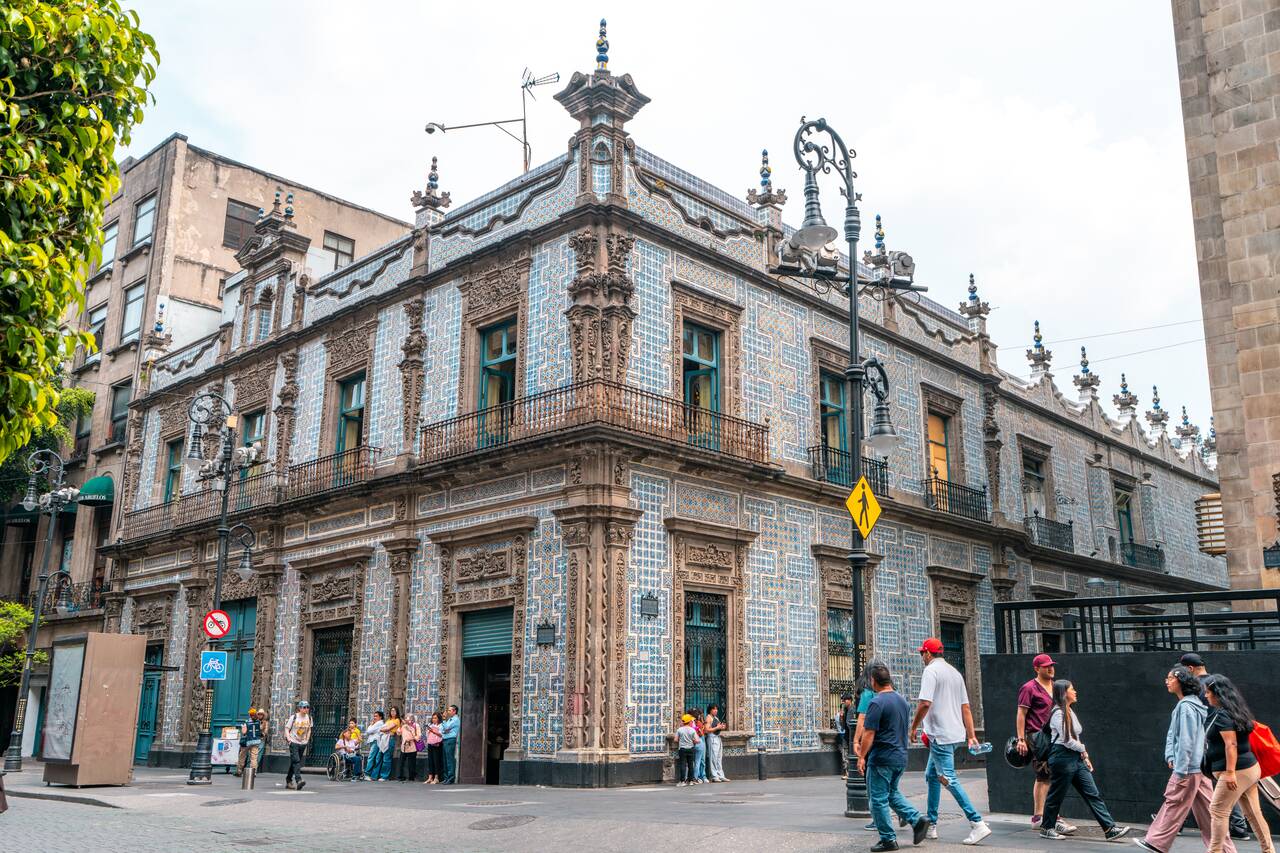 A building with beautiful old blue tiles along Avenida Francisco I. Madero