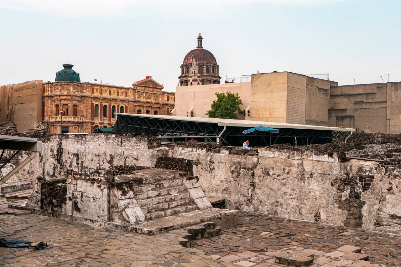 The Templo Mayor Museum's archaeological site set against the Historic Center's structures