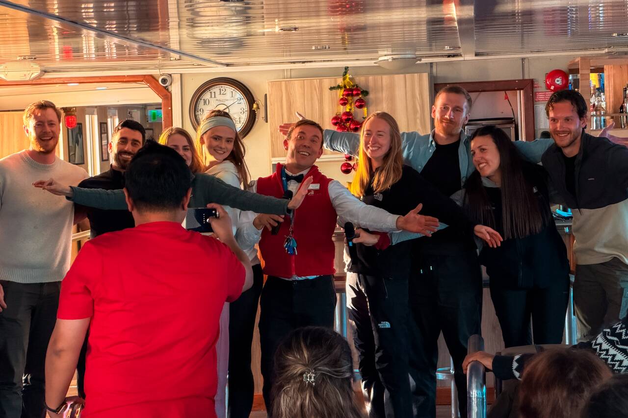 People smiling at a talent show aboard my ship to Antarctica