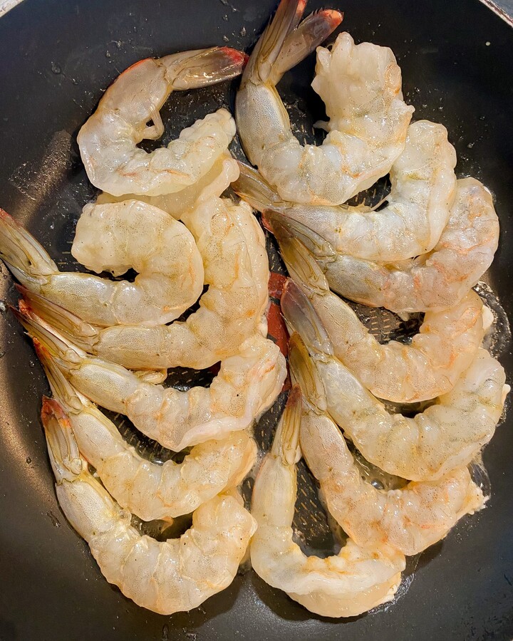Heat the oil in your pan-fried until it is hot. Sear the shrimp on both sides until it turns golden. The shrimp should be 80% cooked. Turn off the heat and remove the shrimp from pan-fried.