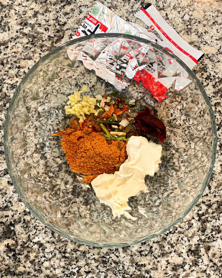 In a small bowl, mix the sauce with the spicy flavor from the flavoring package. Add Mayonnaise, Gochujang, and garlic minced and mix them well together.