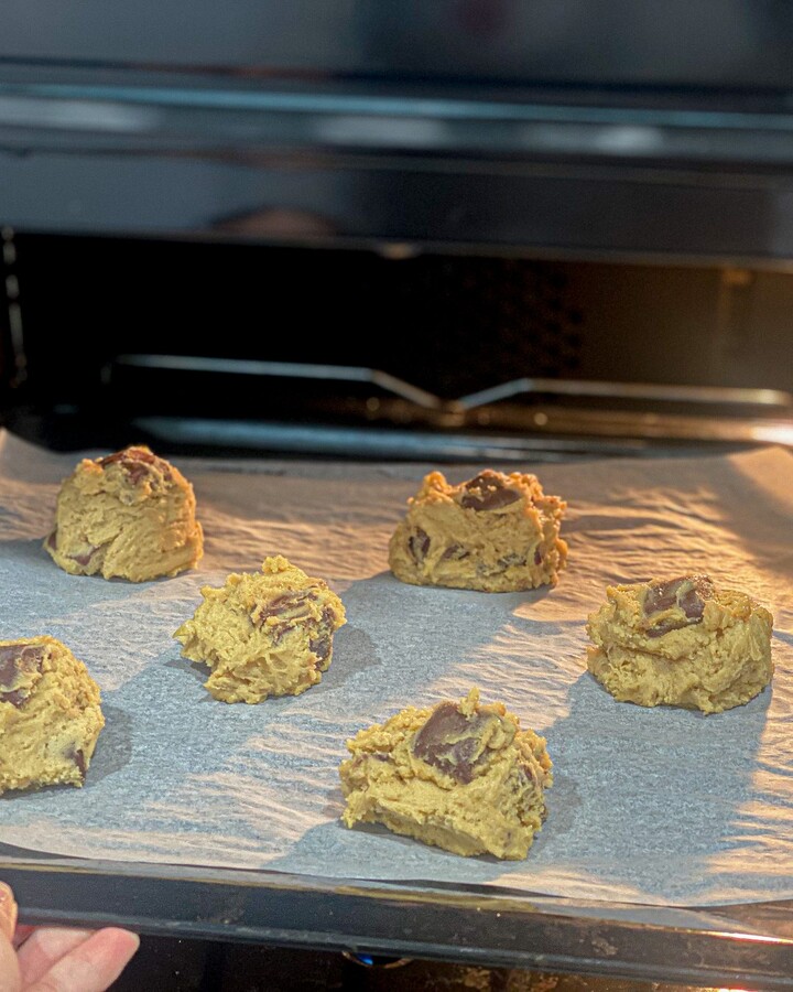 Preheat the oven to 170 °C ( 338 °F). Line a baking sheet with parchment paper. Scoop the dough with ice cream scoop onto the parchment paper sheet. Try to make a chocolate chunk on the middle top of the dough. When it's melted, It will make your cookies look really good. Make sure to leave a little room between each ball of cookie dough. Preheat the oven to 170 °C ( 338 °F). Line a baking sheet with parchment paper. Scoop the dough with ice cream scoop onto the parchment paper sheet. Try to make a chocolate chunk on the middle top of the dough. When it's melted, It will make your cookies look really good. Make sure to leave a little room between each ball of cookie dough.