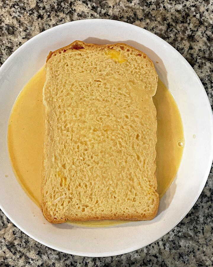 Soak bread in the milk-egg mixture on both sides.