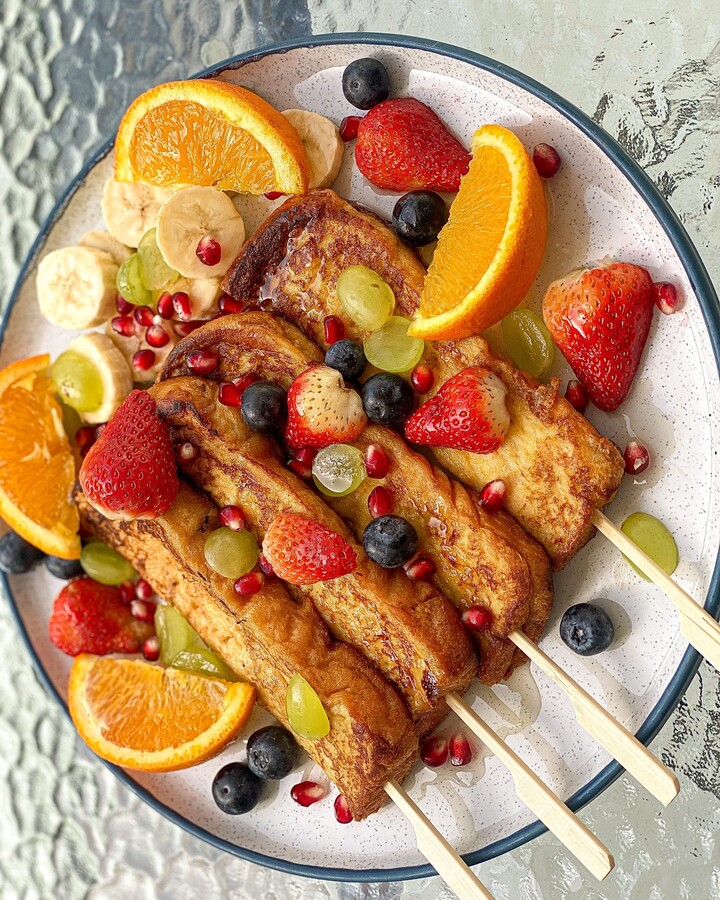 Served with syrup or honey and toppings with berry and fresh fruit.
