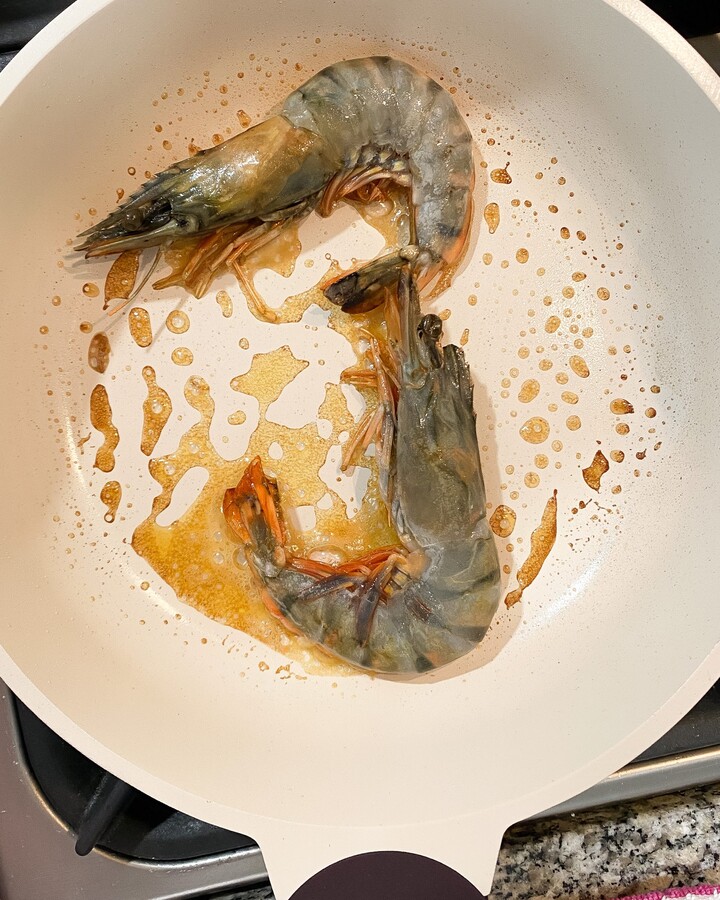 In a pan, add some butter or olive oil and sear the shrimp until it cooks but is not overcooked.